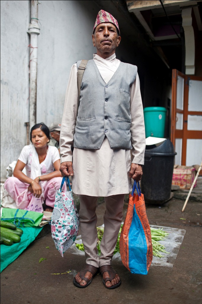 A Nepali man buying organic produce at Singtham market.